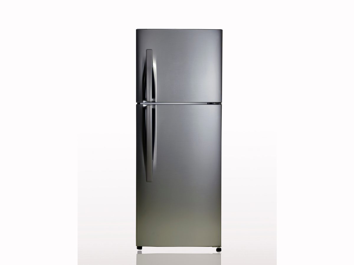 A stainless steel refrigerator with a top freezer, shown on its own.